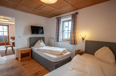 Ein Bett oder Betten in einem Zimmer der Unterkunft Appartements Kirchenwirt