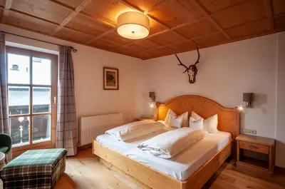 Ein Bett oder Betten in einem Zimmer der Unterkunft Appartements Kirchenwirt