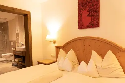Ein Bett oder Betten in einem Zimmer der Unterkunft Appartements Kirchenwirt