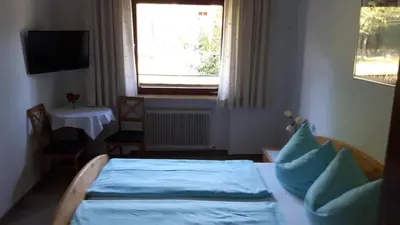 Ein Bett oder Betten in einem Zimmer der Unterkunft Lamplhof B&B