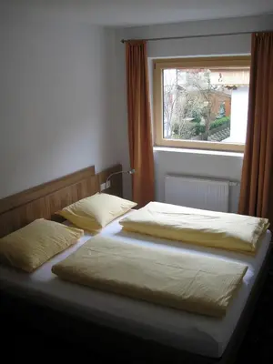 Ein Bett oder Betten in einem Zimmer der Unterkunft Gästehaus Braunegger