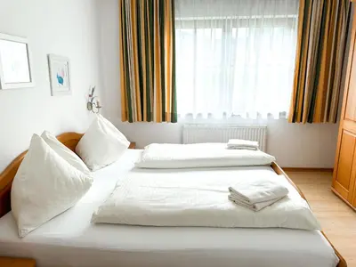 Ein Bett oder Betten in einem Zimmer der Unterkunft Auerschmied Appartements