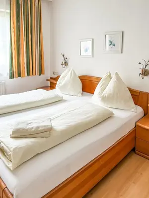 Ein Bett oder Betten in einem Zimmer der Unterkunft Auerschmied Appartements