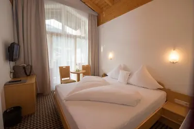 Ein Bett oder Betten in einem Zimmer der Unterkunft Hotel Tristkogel