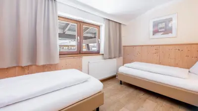 Ein Bett oder Betten in einem Zimmer der Unterkunft Hapimag Saalbach