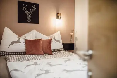Ein Bett oder Betten in einem Zimmer der Unterkunft Chalet Alpenglück