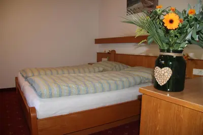 Ein Bett oder Betten in einem Zimmer der Unterkunft Pension Traube