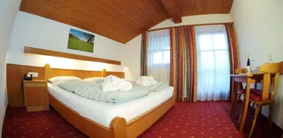 Ein Bett oder Betten in einem Zimmer der Unterkunft Pension Traube
