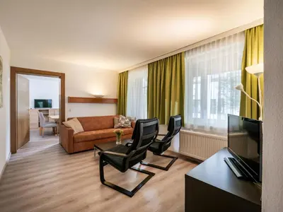 Ein Sitzbereich in der Unterkunft Appartements Pungg