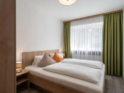 Ein Bett oder Betten in einem Zimmer der Unterkunft Appartements Pungg