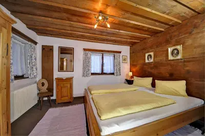 Ein Bett oder Betten in einem Zimmer der Unterkunft Ferienhäuser Reither Almen