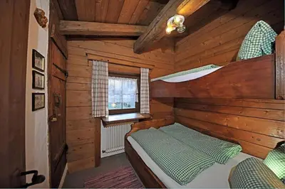 Ein Bett oder Betten in einem Zimmer der Unterkunft Ferienhäuser Reither Almen