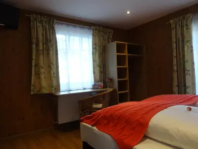 Ein Bett oder Betten in einem Zimmer der Unterkunft Pension Rosenhof