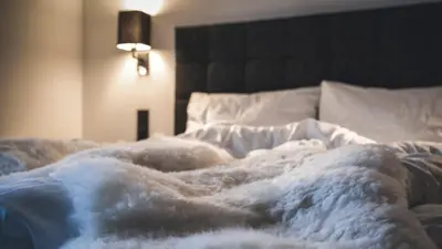 Ein Bett oder Betten in einem Zimmer der Unterkunft Appartementhaus Das Vidum