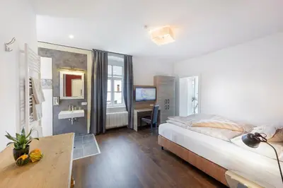 Ein Bett oder Betten in einem Zimmer der Unterkunft Villa Maria - Suiten & Appartement