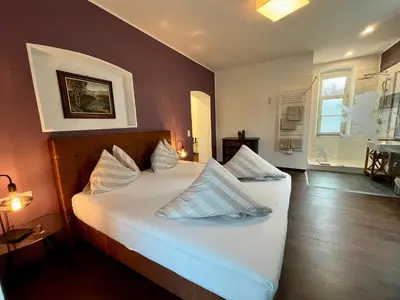 Ein Bett oder Betten in einem Zimmer der Unterkunft Villa Maria - Suiten & Appartement