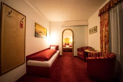 Ein Bett oder Betten in einem Zimmer der Unterkunft Hotel Garni Wolfgang