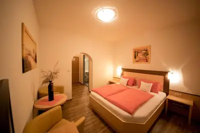 Ein Bett oder Betten in einem Zimmer der Unterkunft Hotel Garni Wolfgang