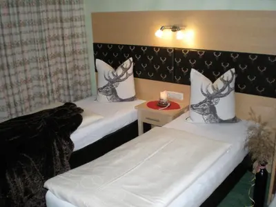 Ein Bett oder Betten in einem Zimmer der Unterkunft Hotel Garni Wolfgang