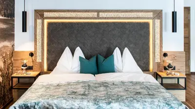 Ein Bett oder Betten in einem Zimmer der Unterkunft Wohlfühlhotel Innertalerhof