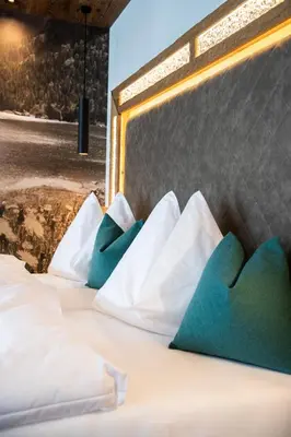 Ein Bett oder Betten in einem Zimmer der Unterkunft Wohlfühlhotel Innertalerhof