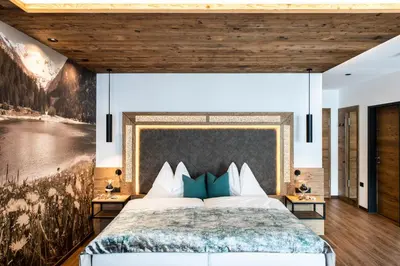 Ein Bett oder Betten in einem Zimmer der Unterkunft Wohlfühlhotel Innertalerhof