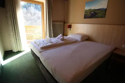 Ein Bett oder Betten in einem Zimmer der Unterkunft Gasthof Alpensport - inklusive Joker Card