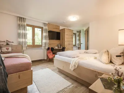 Ein Bett oder Betten in einem Zimmer der Unterkunft Café Pension Koller