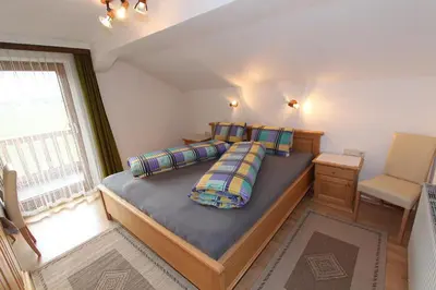 Ein Bett oder Betten in einem Zimmer der Unterkunft Gästehaus Hauser