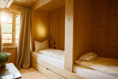 Ein Bett oder Betten in einem Zimmer der Unterkunft HochLeger - Chalet Refugium am Berg