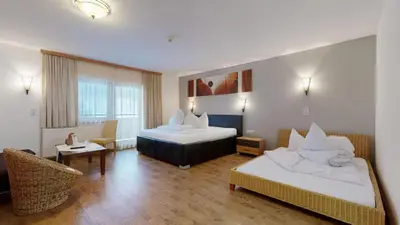 Ein Bett oder Betten in einem Zimmer der Unterkunft Denggenhof