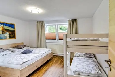 Ein Bett oder Betten in einem Zimmer der Unterkunft Ferienwohnung Ellmerer
