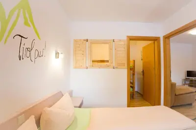 Ein Bett oder Betten in einem Zimmer der Unterkunft Aparthotel Hummerau