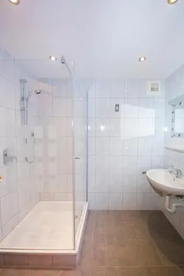 Ein Badezimmer in der Unterkunft Aparthotel Hummerau