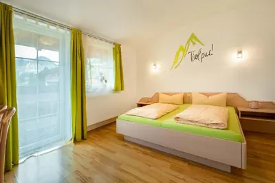 Ein Bett oder Betten in einem Zimmer der Unterkunft Aparthotel Hummerau
