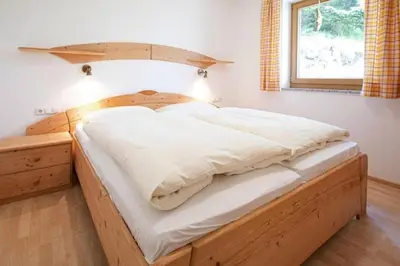 Ein Bett oder Betten in einem Zimmer der Unterkunft Holiday flat Bärlerhof XXL, Königsleiten