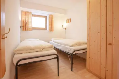 Ein Bett oder Betten in einem Zimmer der Unterkunft Holiday flat Bärlerhof XXL, Königsleiten
