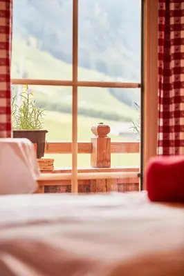 Ein Bett oder Betten in einem Zimmer der Unterkunft Apartchalet Jörglerhof