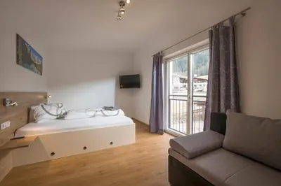 Ein Bett oder Betten in einem Zimmer der Unterkunft Ferienwohnung Thaler