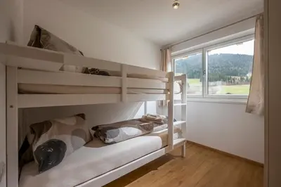 Ein Bett oder Betten in einem Zimmer der Unterkunft Ferienwohnung Thaler
