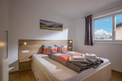 Ein Bett oder Betten in einem Zimmer der Unterkunft Ferienwohnung Thaler