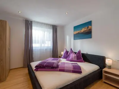 Ein Bett oder Betten in einem Zimmer der Unterkunft Ferienwohnung Treichl