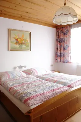 Ein Bett oder Betten in einem Zimmer der Unterkunft Ferienwohnung Innerhofer
