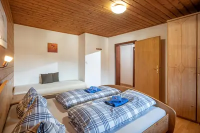 Ein Bett oder Betten in einem Zimmer der Unterkunft Talhammerhof