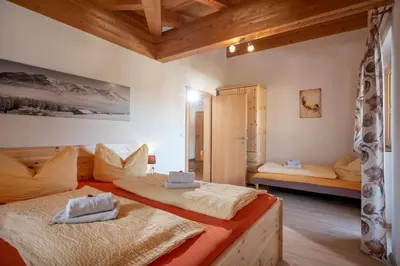 Ein Bett oder Betten in einem Zimmer der Unterkunft Talhammerhof