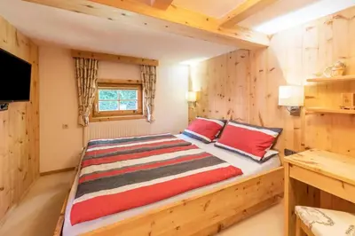Ein Bett oder Betten in einem Zimmer der Unterkunft Chalet - Direkt am 5 Sterne Campingplatz Aufenfeld im Zillertal mit Hallenbad und Sauna