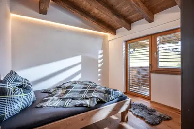 Ein Bett oder Betten in einem Zimmer der Unterkunft Alpenchalet 