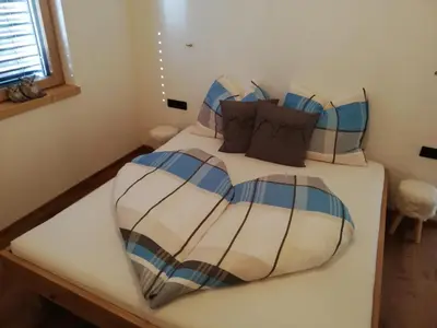 Ein Bett oder Betten in einem Zimmer der Unterkunft Alpenchalet 