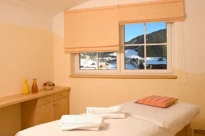 Ein Bett oder Betten in einem Zimmer der Unterkunft Hotel Sportalm