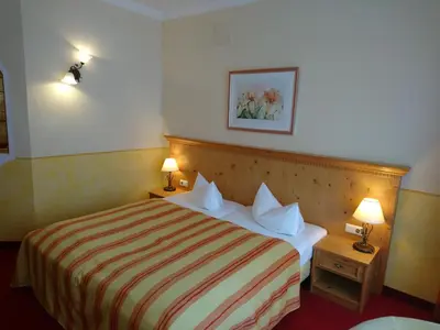 Ein Bett oder Betten in einem Zimmer der Unterkunft Hotel Sportalm